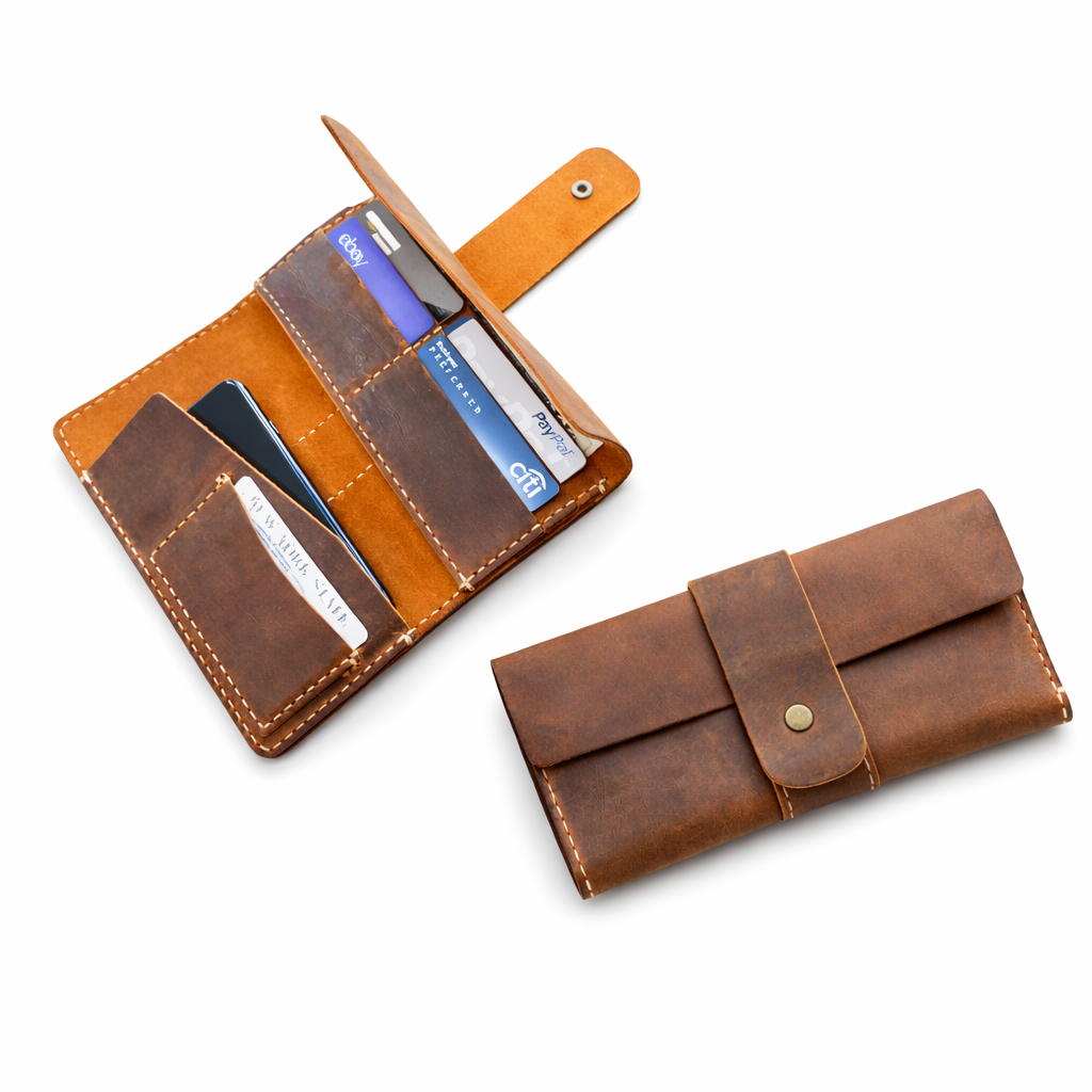 Brown leather wallet with card slots and pen holder on a white background
